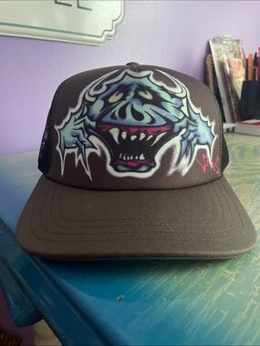 Vans Wyman Trucker Graffiti Hat in the Coal Brown colorway